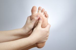 Holding bottom feet pain